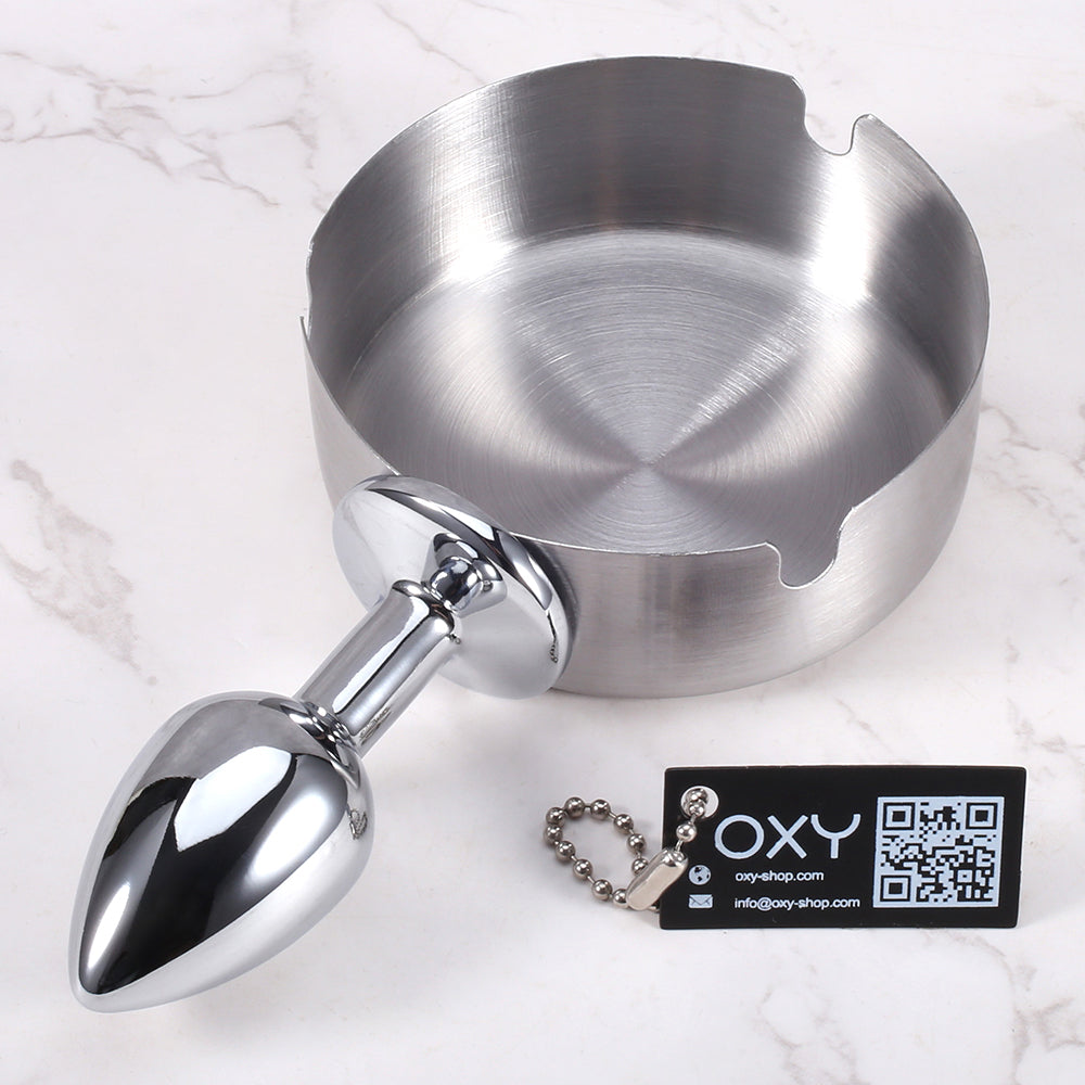 Anal plug with an integrated stainless steel ashtray top, polished chrome finish, and stable base for BDSM roleplay.