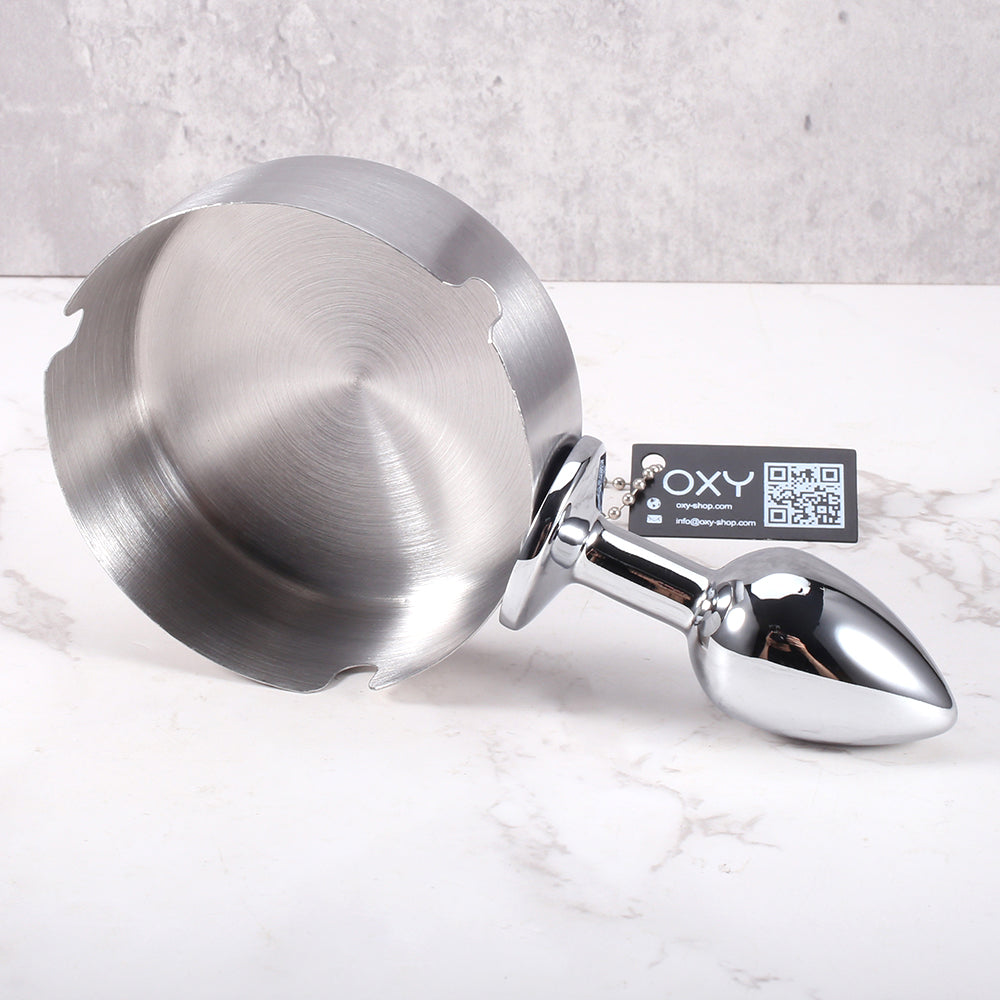 Cheeky anal plug with an ashtray-style top, featuring a sleek metallic finish and stable base for BDSM roleplay.